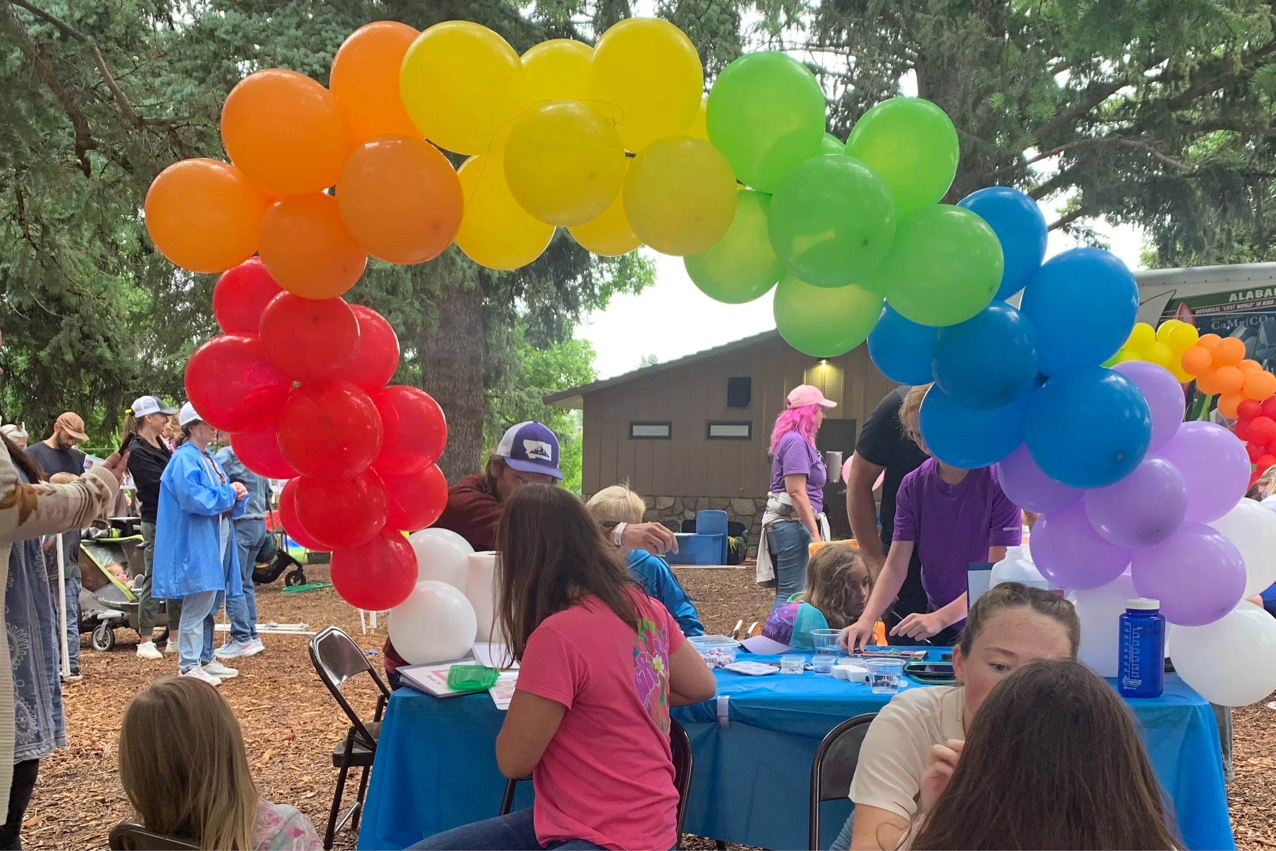 Children painting and making crafts in Sweet Pea Festival’s Children’s Village, Bozeman