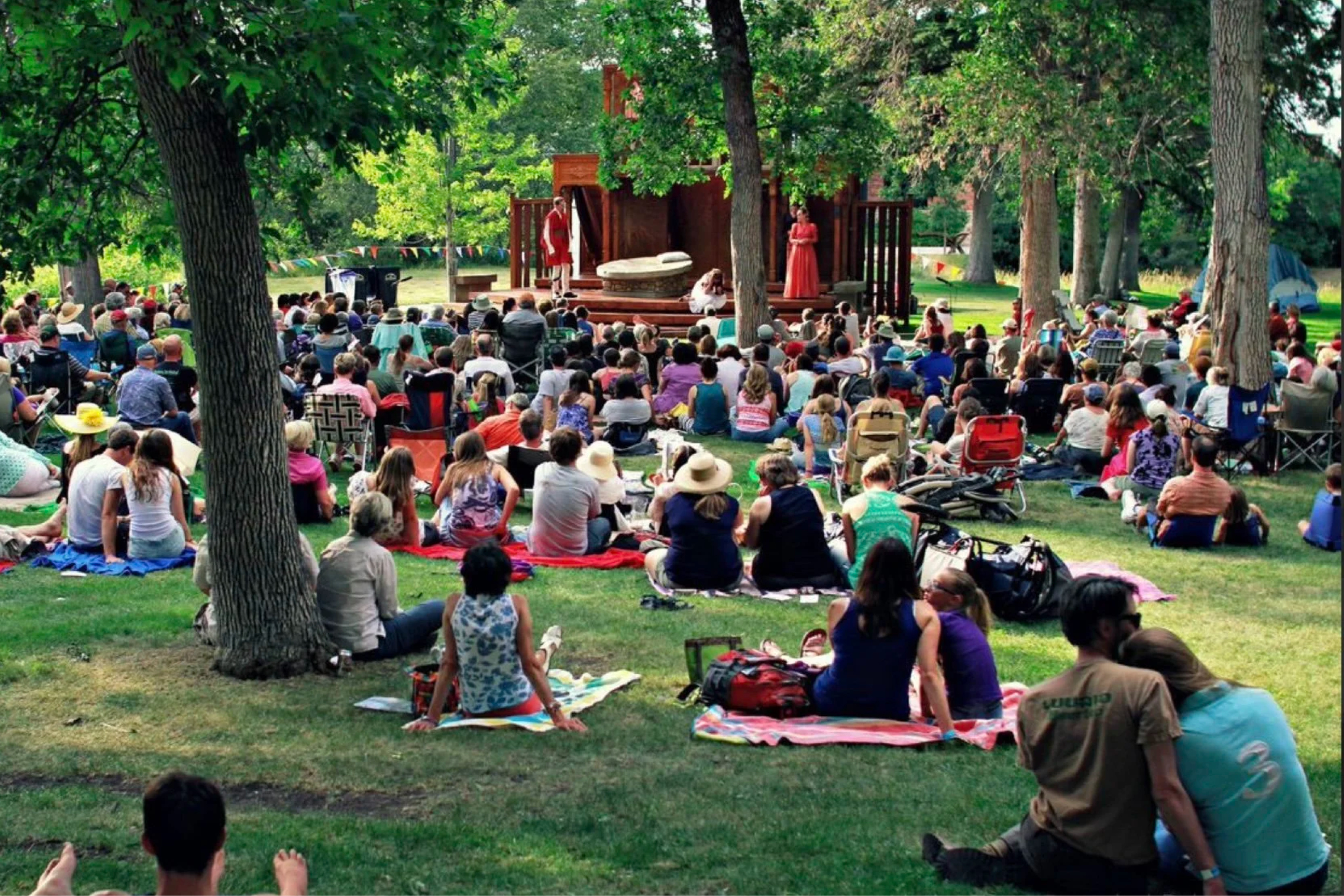 Crowds and musicians on stage at Lindley Park during Bozeman Sweet Pea Festival live music even